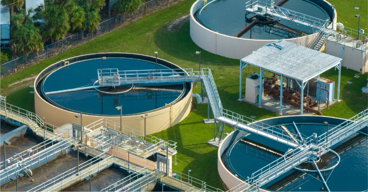 Aerial view of circular clarifier tanks at a wastewater treatment plant